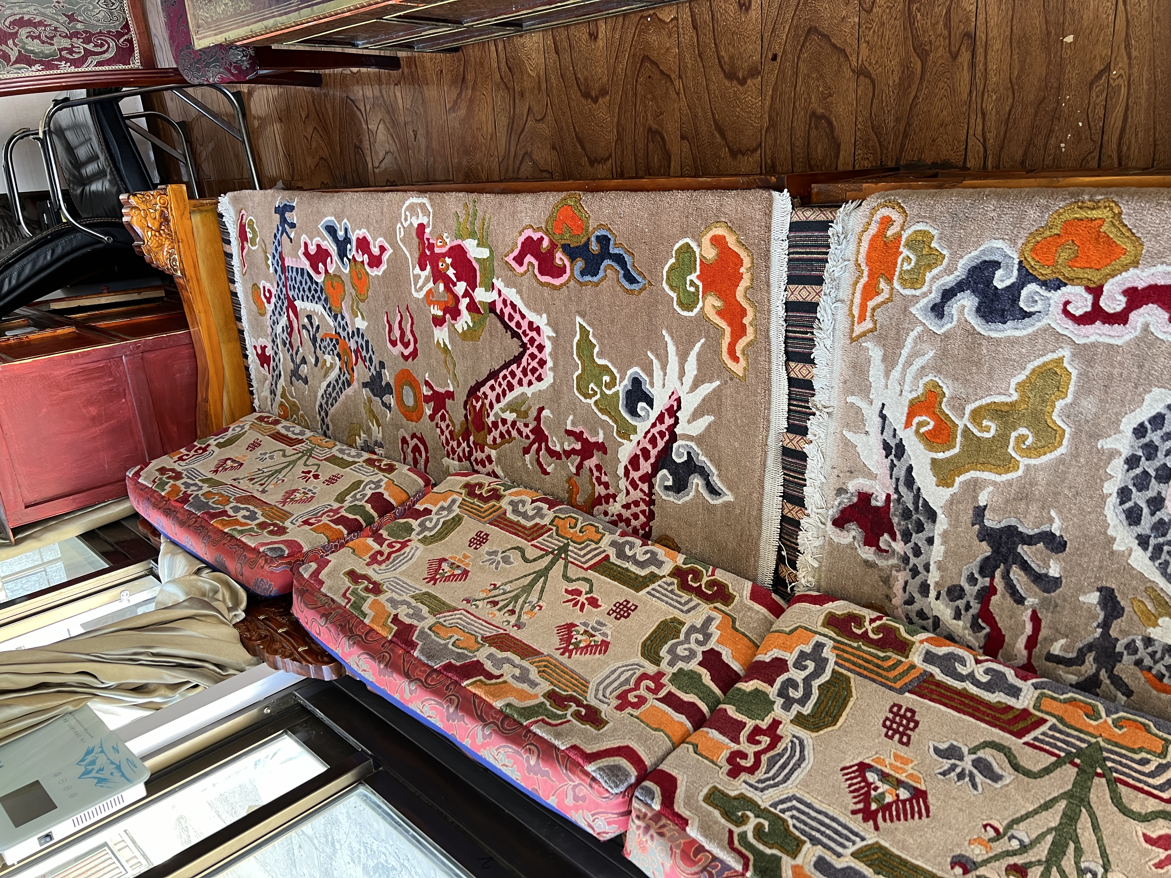 Artisan weaving on a traditional vertical loom